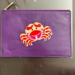 Diane Von Furstenberg purple cancer clutch.